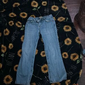 A pair of straight jeans, little bit darker thank light washed, old navy